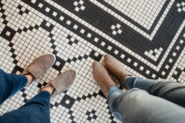 Feet on a mosaic tile floor