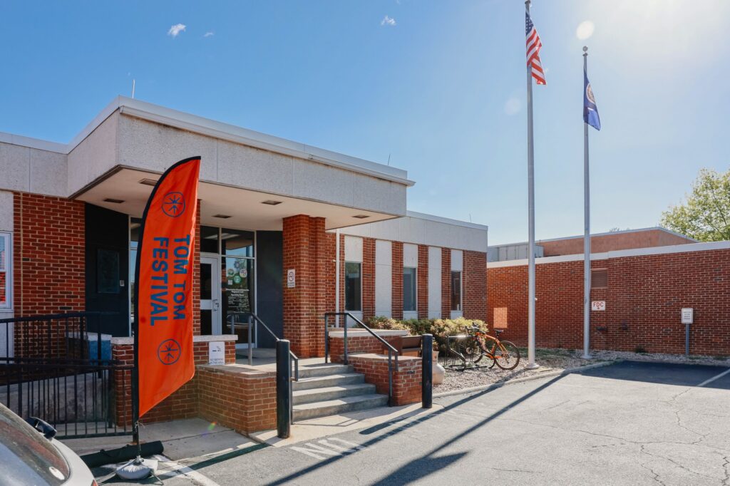 Photo of jail, with Tom Tom Festival sign outside